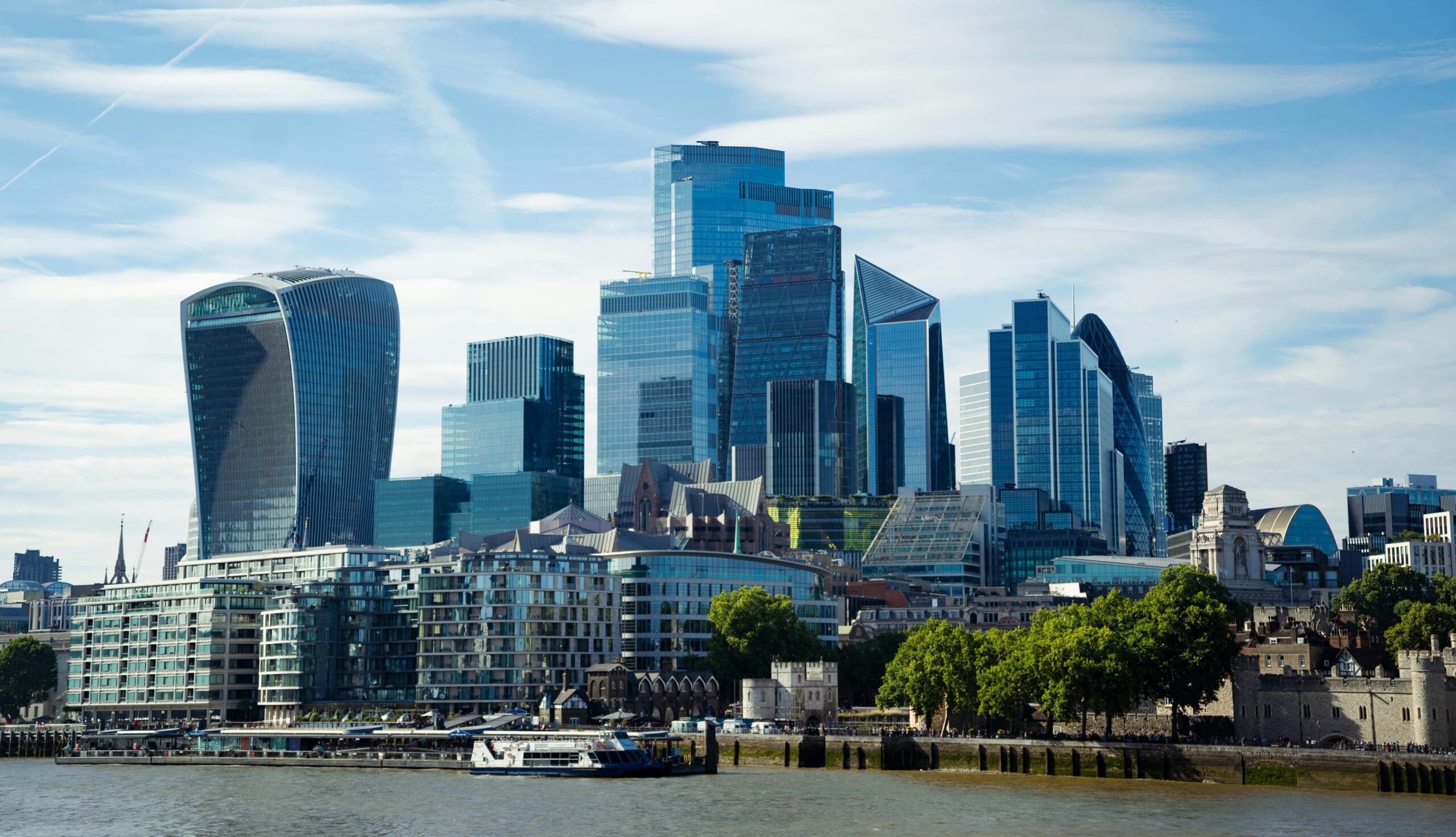 London skyline and the River Thames at dusk viewed from the South Bank