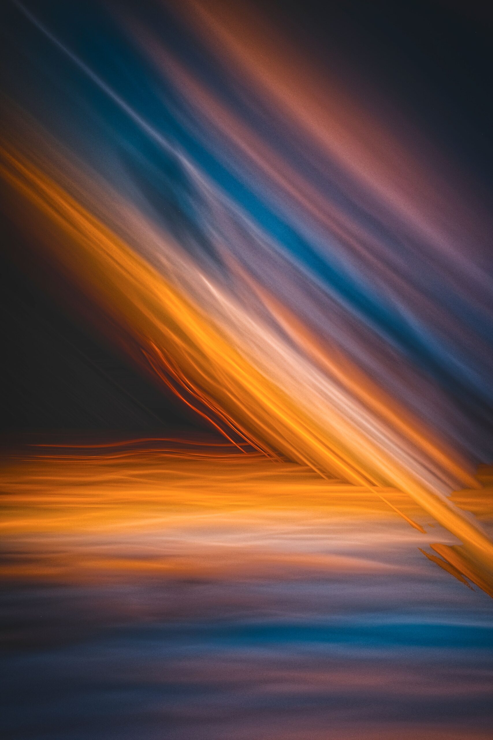 Abstract dynamic light streaks in motion with flowing blue and purple tones, illustrating movement, growth and change.