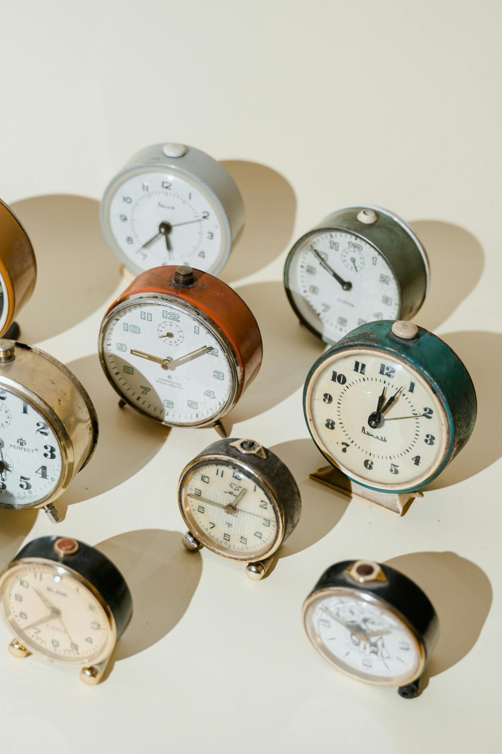 Collection of antique alarm clocks representing retirement planning and the importance of timing